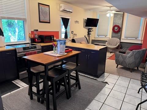 The open concept living, kitchen, dining area has flexibility and space for several types of group or individual needs and activities.