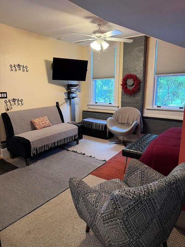 The living space has seating for entertaining, game nights, or a cozy evening in bed streaming movies.