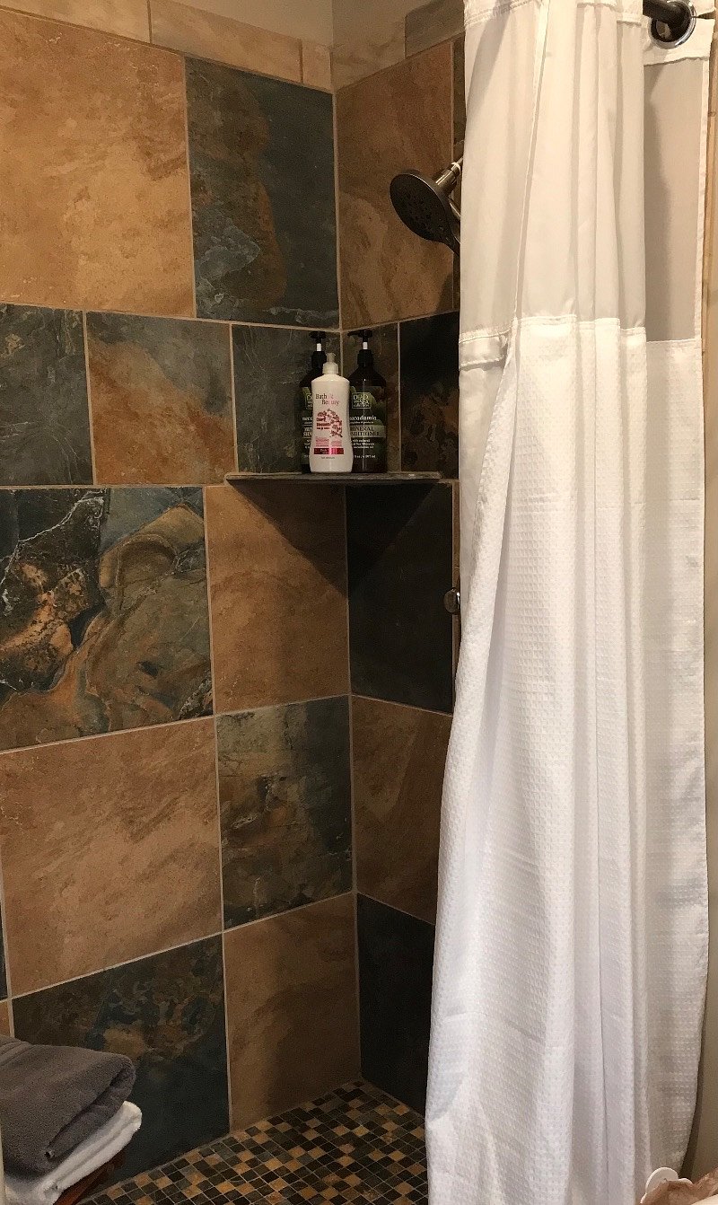 Large walk in shower with shampoo,  conditioner  and shower gel 