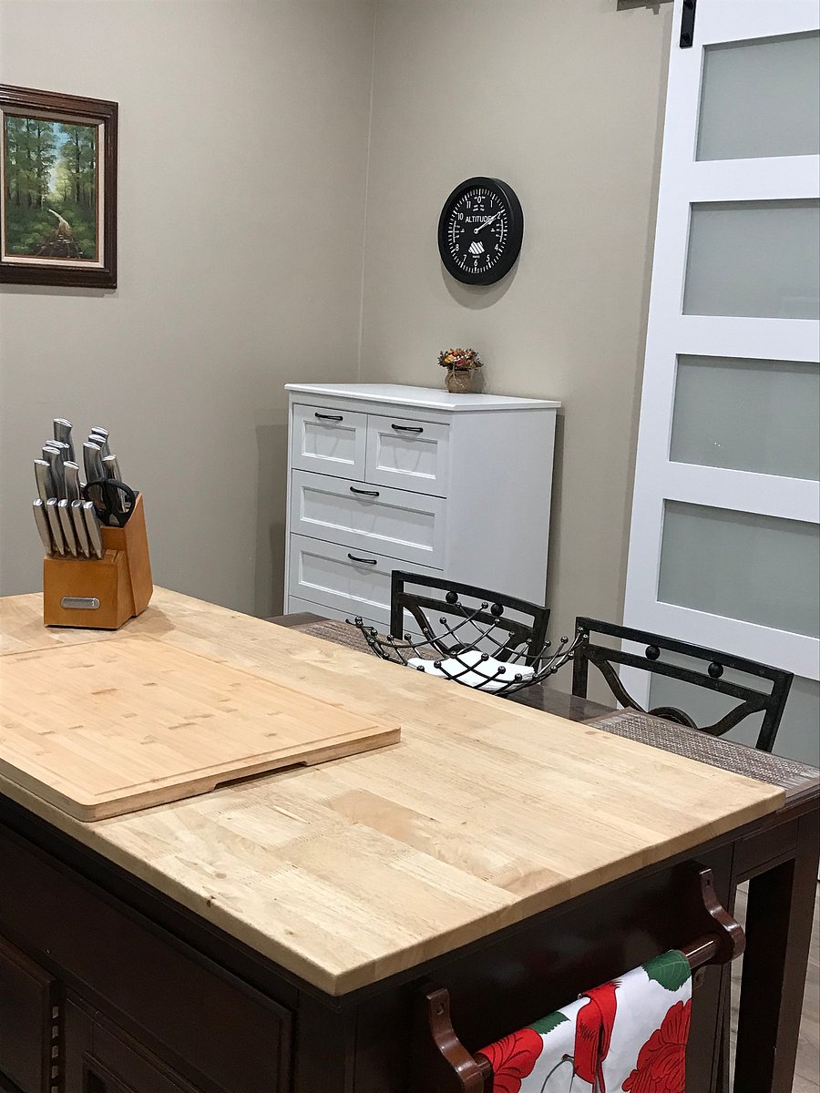 Pull out table or desk.  Electrical outlet on side of island.