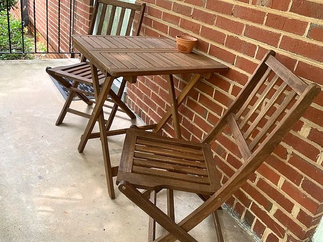 Front entry with small table and chairs. Space is shared with neighbor but furniture does belong to us.