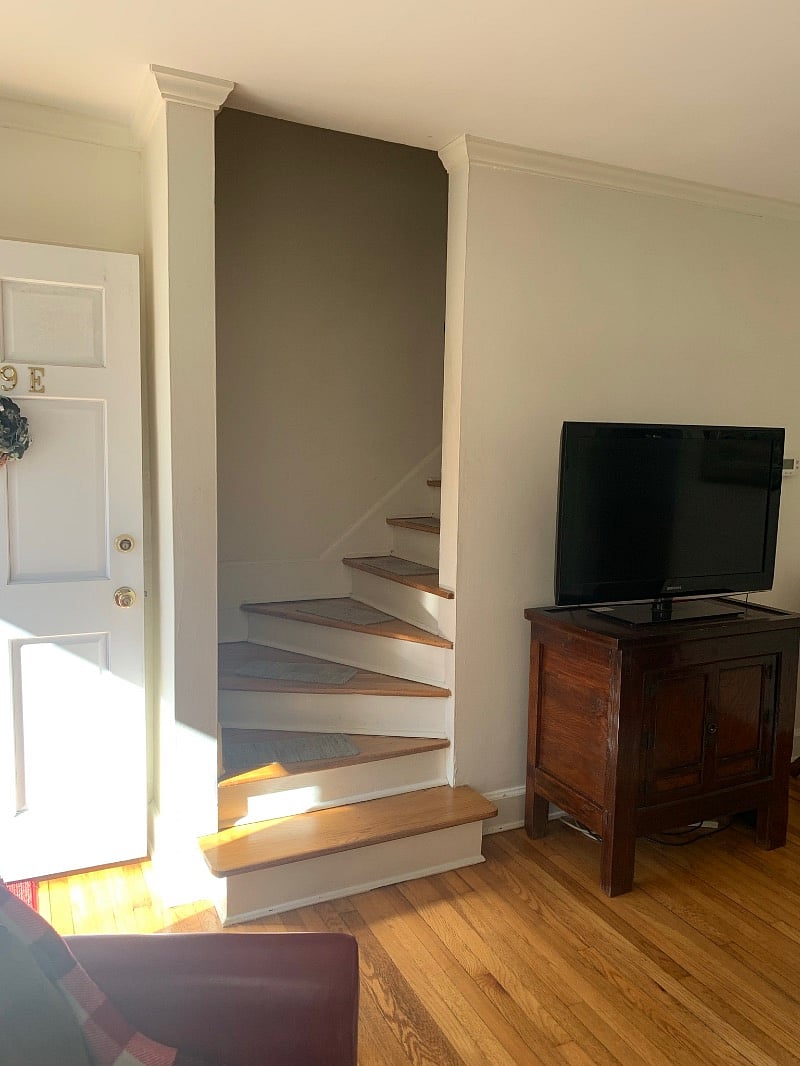 Stairwell just inside from front entry. Narrow space leading upstairs.