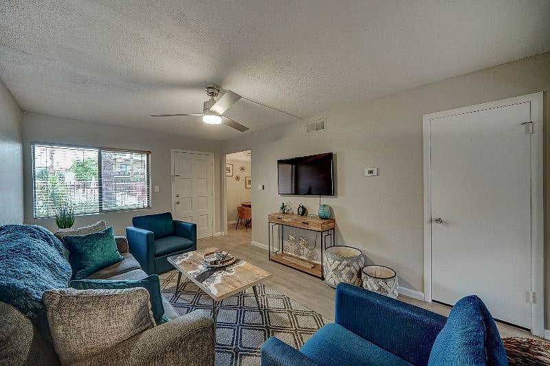 Living room has plenty of seating and a 50" Smart TV with YouTube TV, Hulu and Netflix