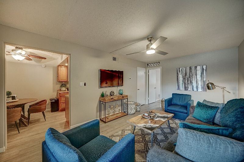 Living room has plenty of seating and a 50" Smart TV with YouTube TV, Hulu and Netflix