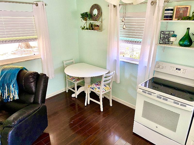 Quaint dining area. New full size stove with glass top range.
