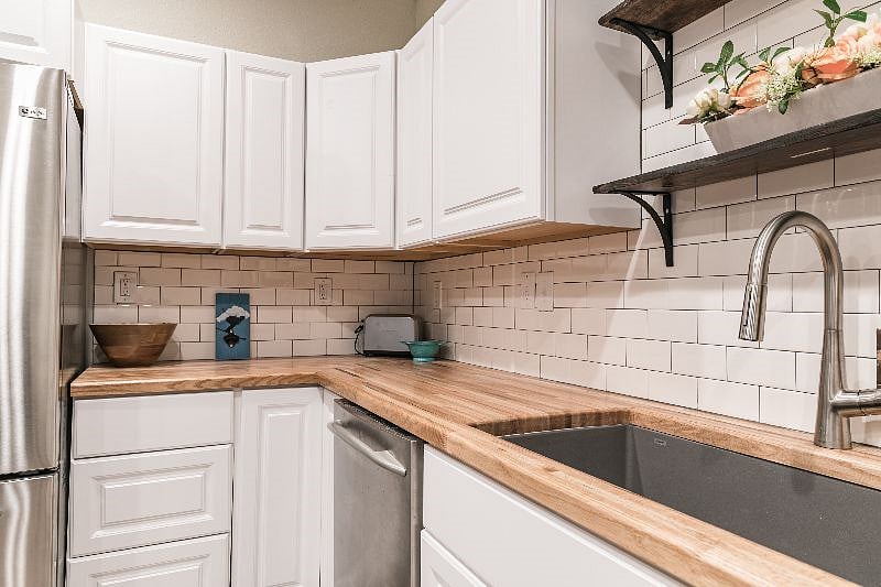 There is a large counter-top oven that is next to the fridge. It is big enough for a large frozen pizza. It is not in this picture, but is in the suite. FYI