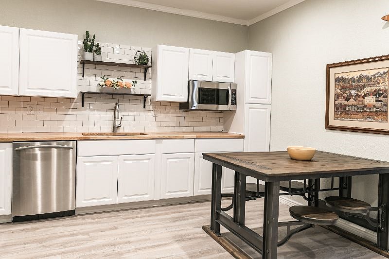 There is a two-burner cooktop under the microwave that was installed after this picture was taken.