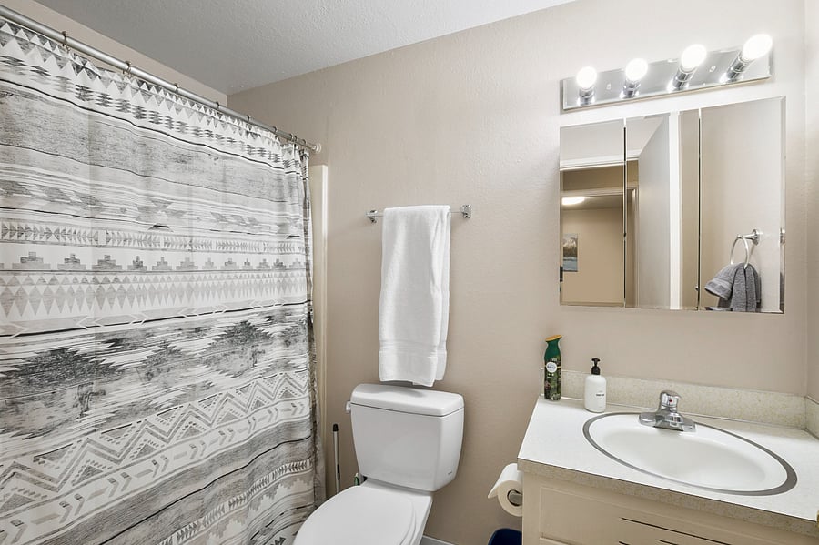 Full size bathroom with tub and shower.