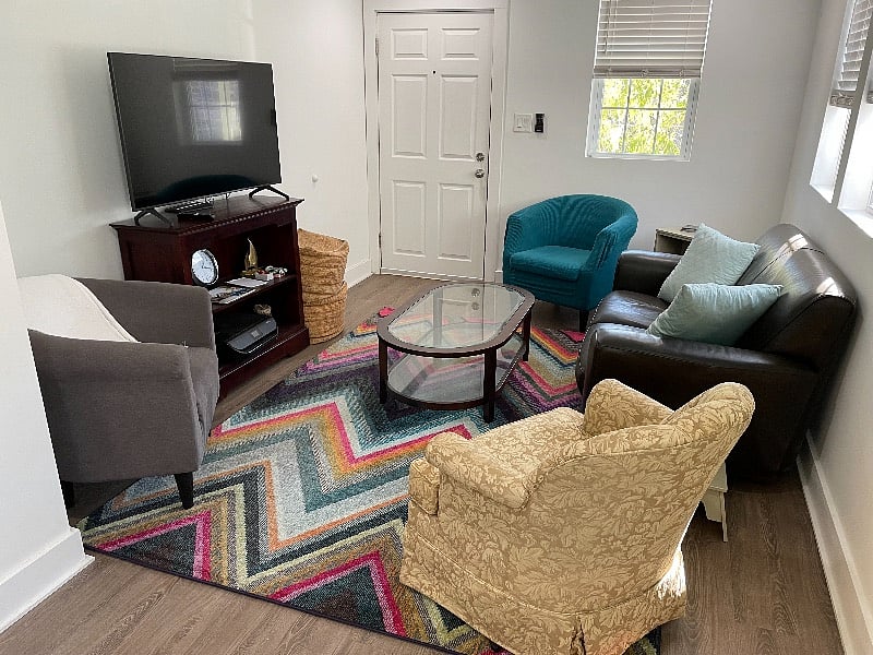 Living room.
Samsung smart tv, printer, loveseat, swivel chair, arm chairs.
