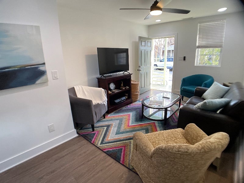 Living room.
Samsung smart tv, printer, loveseat, swivel chair, arm chairs.