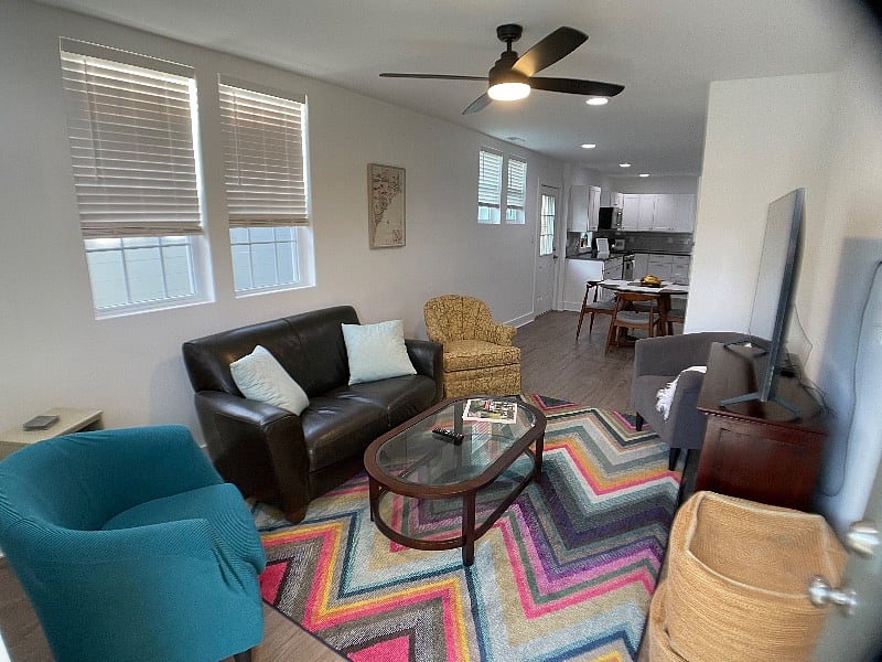 Living room.
Samsung smart tv, printer, loveseat, swivel chair, arm chairs.