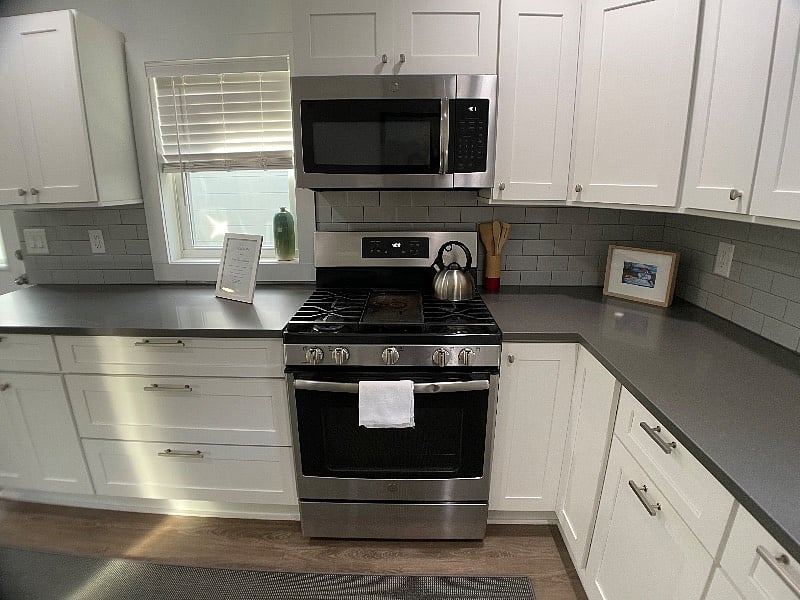 Kitchen.
Fully stocked with dishes, silverware, pots and pans, coffee makers, dishwasher, full sized refrigerator, range, microwave.