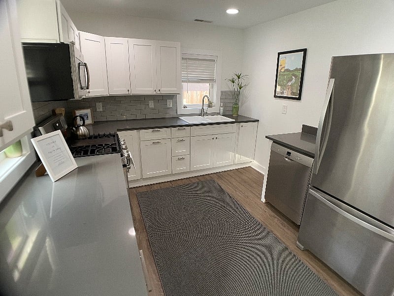 Kitchen.
Fully stocked with dishes, silverware, pots and pans, coffee makers, dishwasher, full sized refrigerator, range, microwave.