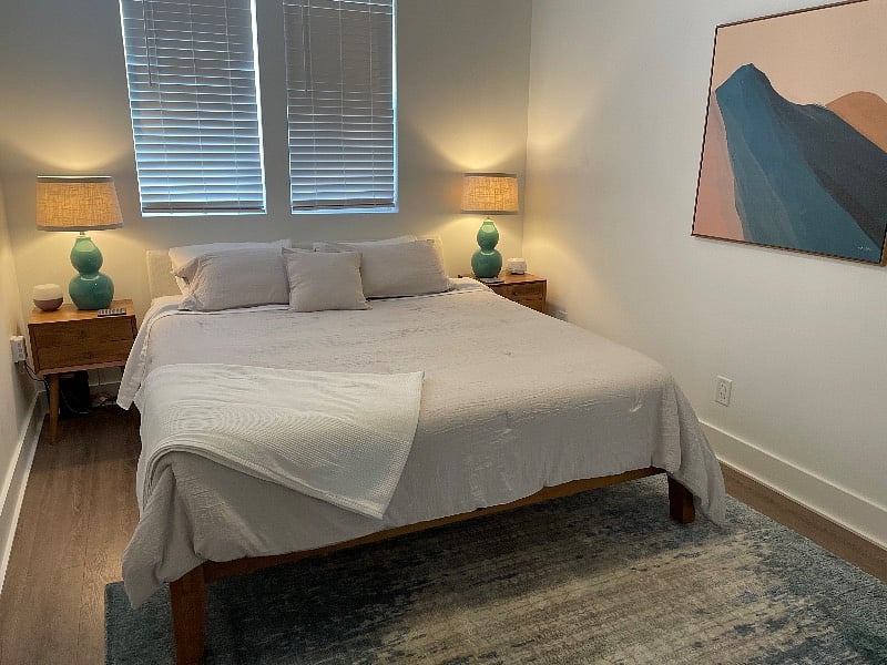 Master bedroom.
California King, organic Birch mattress w pillow topper, sound machine, essential oil diffuser, alarm clock.