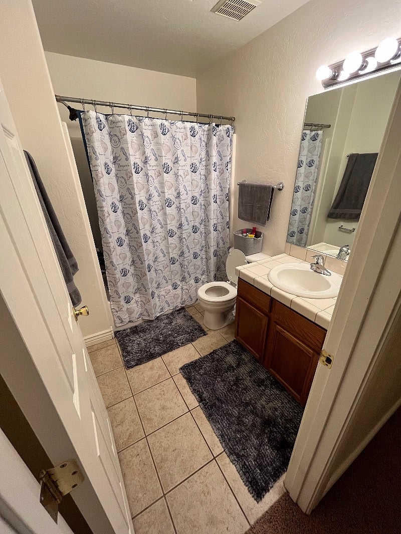 Full bath. This is shared by renters in the two hall bedrooms. (Half bath also available downstairs)