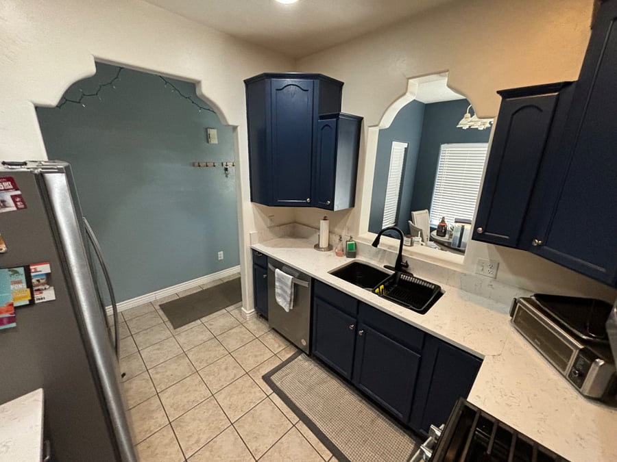 Fully stocked kitchen. Stainless steel appliances. Quartz countertops. 