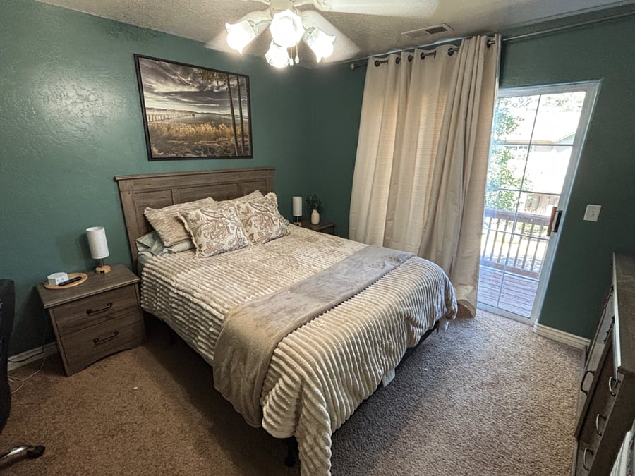 Primary bedroom with queen bed, ensuite bathroom, smart TV and plenty of dressers/closet space for your things.  Desk to work from home too!
