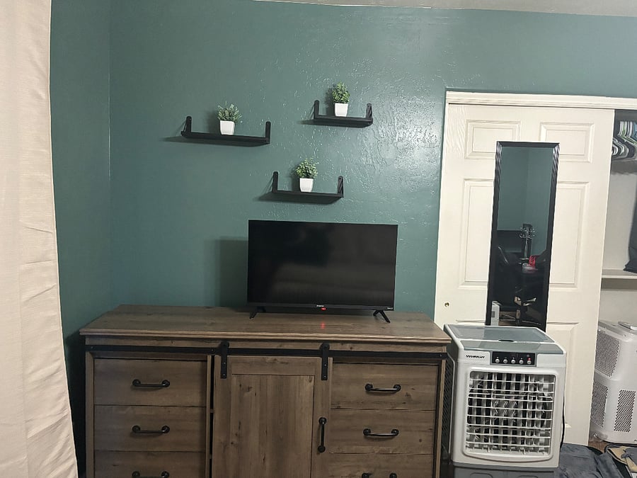 Primary bedroom with queen bed, ensuite bathroom, smart TV and plenty of dressers/closet space for your things.  Desk to work from home too!
