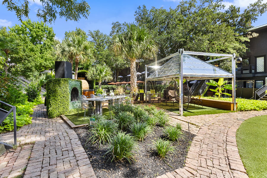 Garden paths and greens for morning stretches.