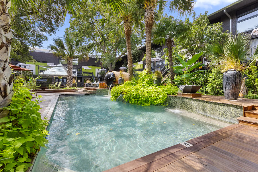 Lush, resort-style pool for a soothing unwind in our wellness inspired courtyard. 