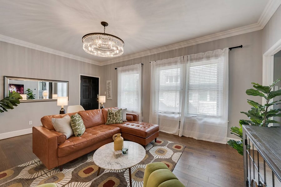 Bright and spacious living room with plenty of natural light, offering a comfortable and inviting space to relax.