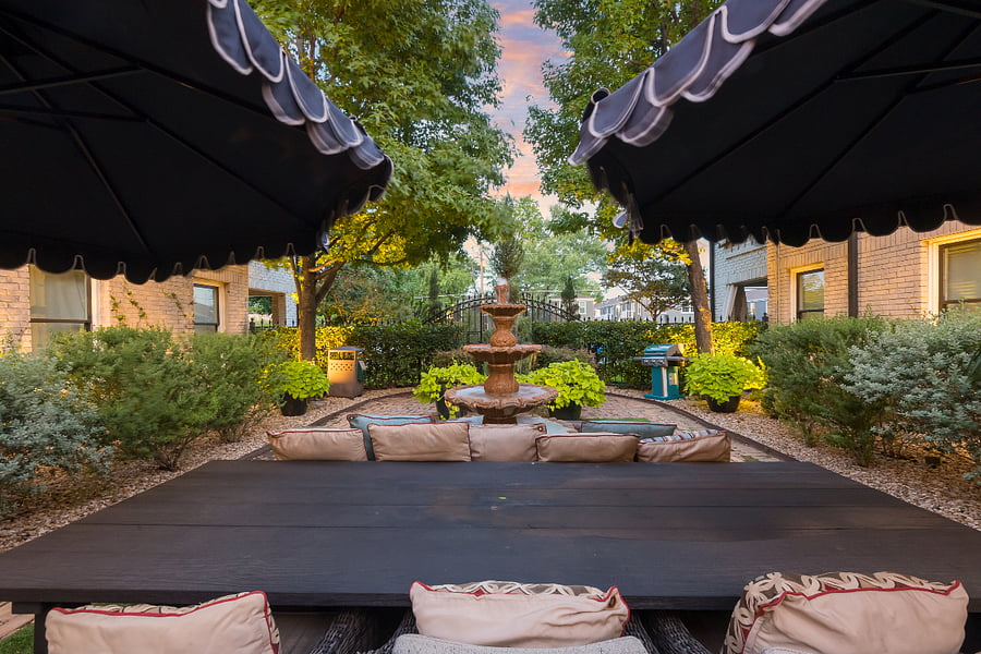 Peaceful gathering spot with soothing water features and seating