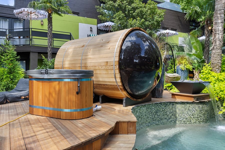 Enjoy your second wellness Resort style courtyard @ 6011 Gaston Ave with striped umbrellas and garden paths. Wellness products available for our residents.