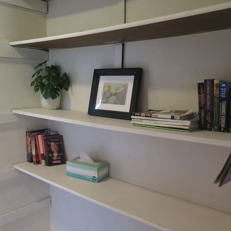 Hallway has shelves