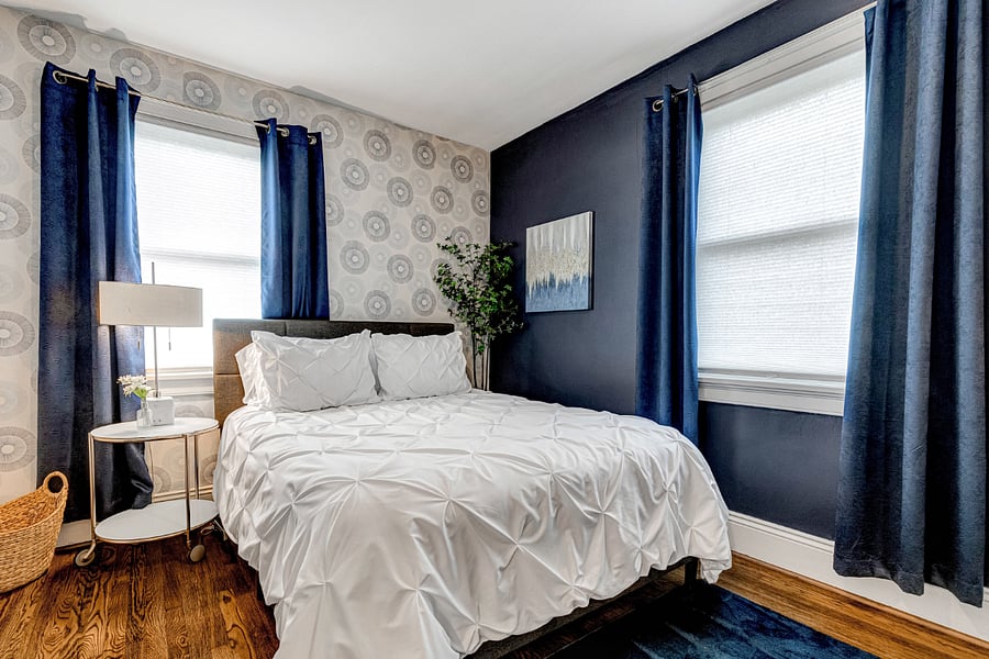 Serene blue bedroom with luxurious bedding for a peaceful nights rest.