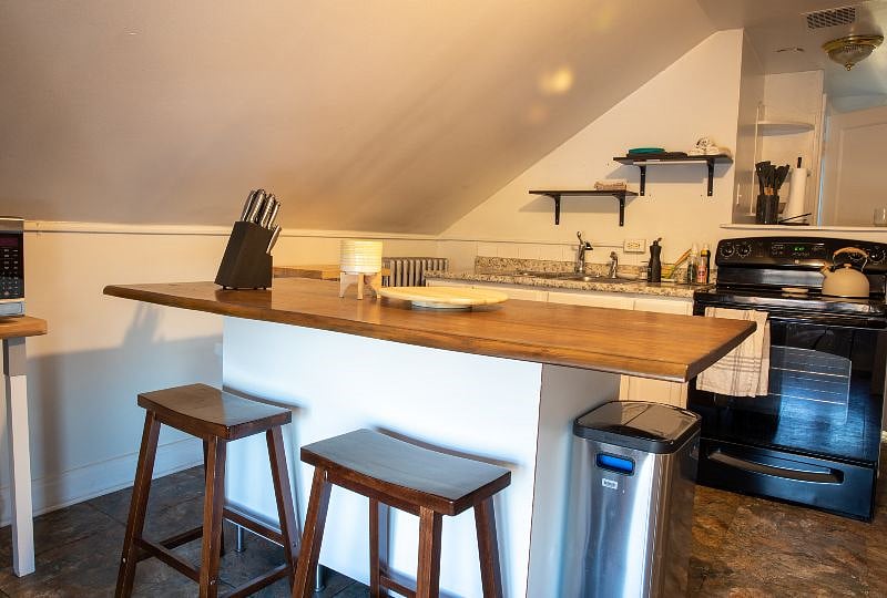 Two stools and leg room to sit/eat at counter.
