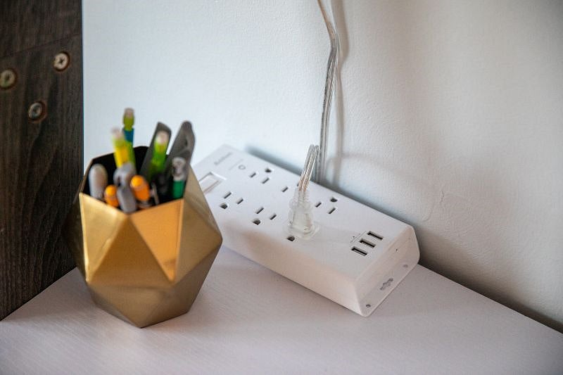 Charging station on desk in living room.