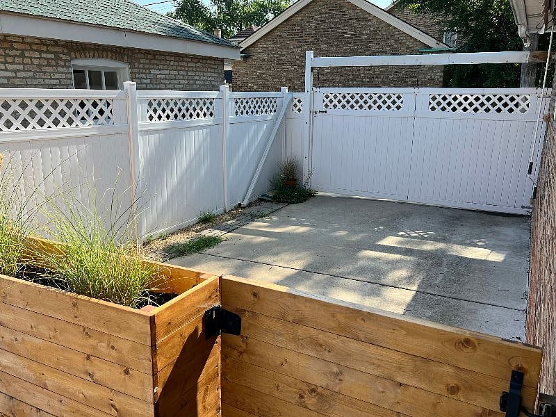 Private parking pad for tenants. Manual gate accessible from the alley.