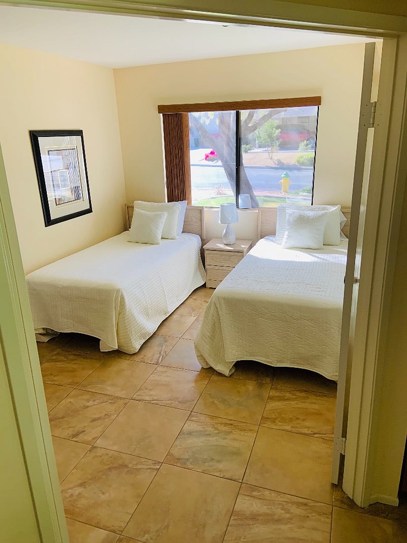 Second/guest bedroom currently with twin beds and room also has full-size closet