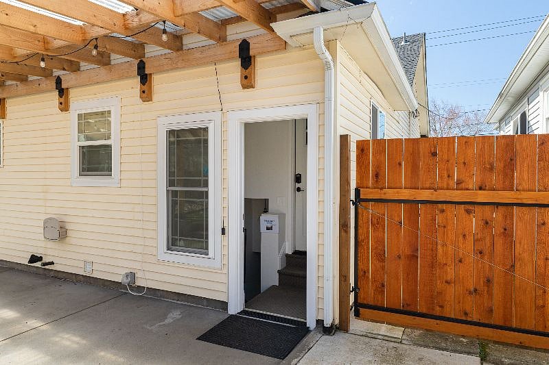 Entrance to guest suite, see second door into the rest of the home up the two stairs. Stairs to the guest area are to the left.