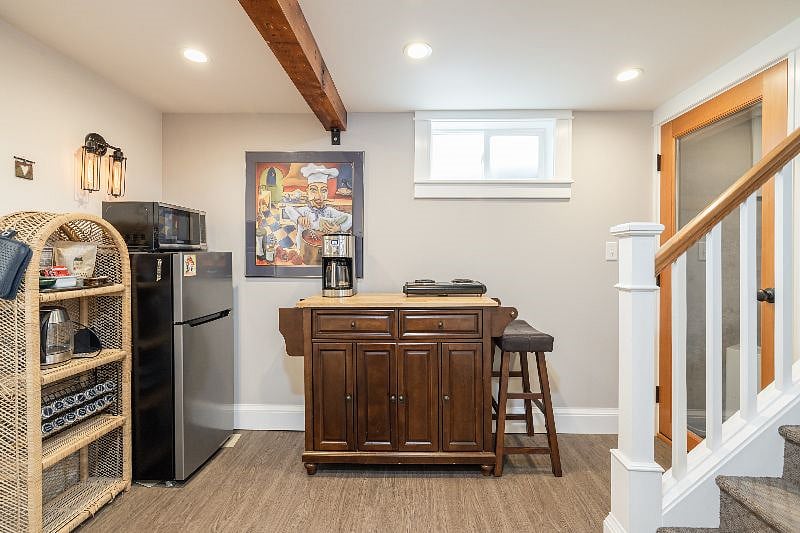 kitchenette area and stairs going to exit. More appliances not shown. And more photos of this at the end.