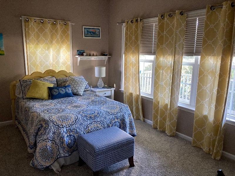 Guest bedroom with walk-in closet, black out blinds