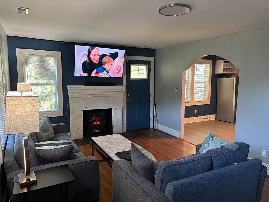 Living Room with 55 inch Smart TV and Fireplace