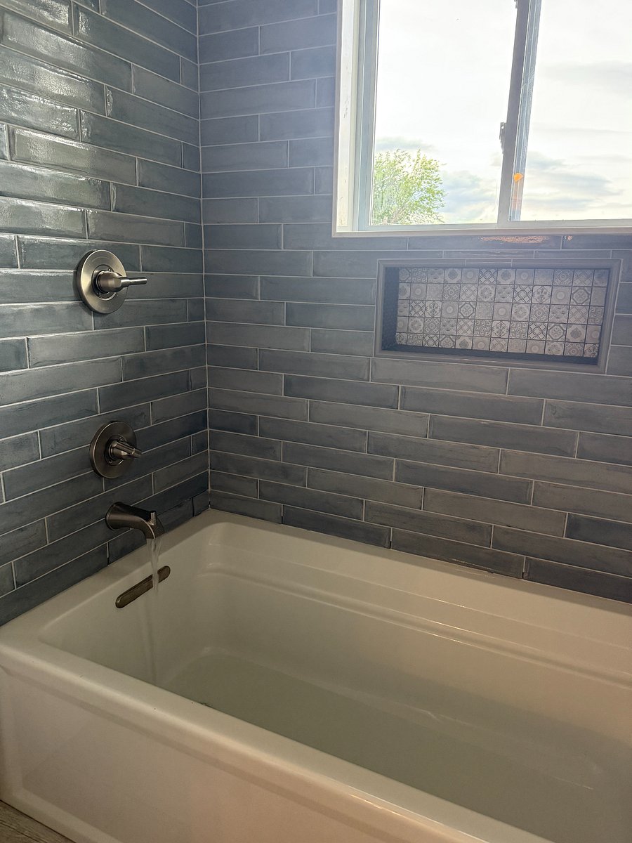 Second floor shared use full bath w/waterfall shower, 6ft soaker tub.