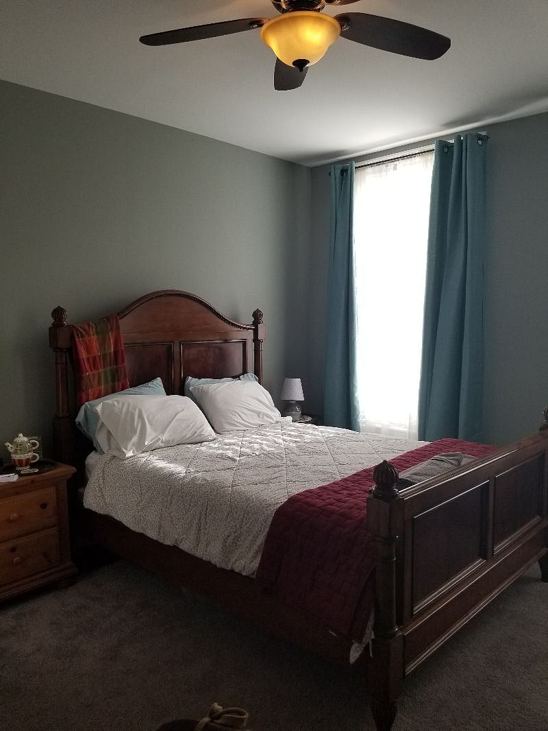 Second floor rear bedroom with queen bed, nonworking fireplace, device ready flat screen tv, bed linens, towels and blackout curtains.Skeleton key locks your bedroom door.