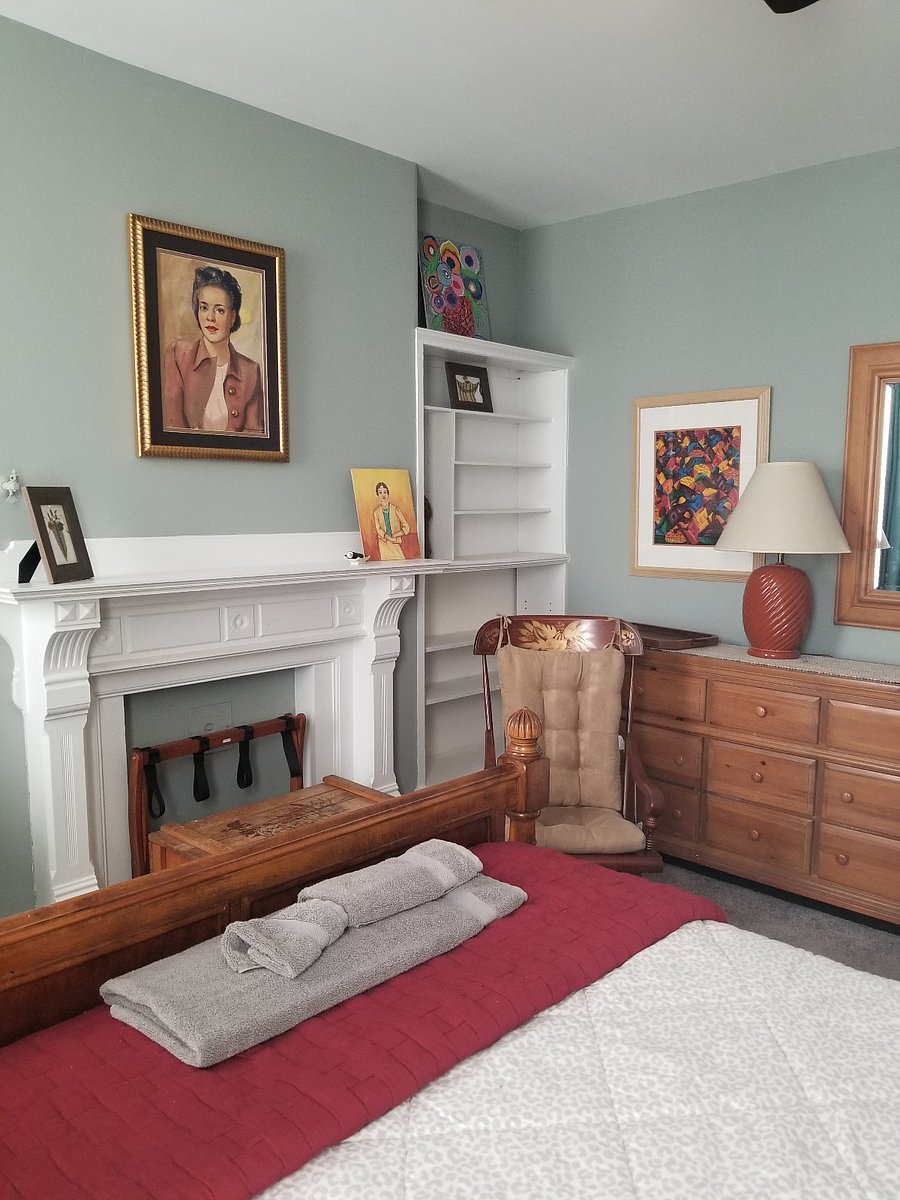 Second floor rear bedroom nonworking fireplace, device ready flat screen tv, bed linens, towels and blackout curtains. Skeleton key locks your bedroom door.