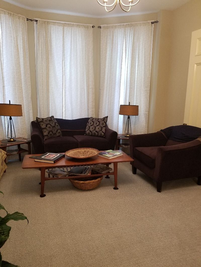 First floor livingroom with nonworking fireplace. Available to all tenants.