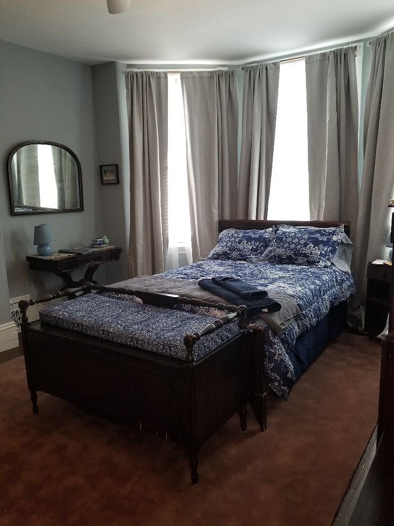 Third floor front bedroom with noworking fireplace, device ready flat screen tv, bed linens, towels and blackout curtains.
Skeleton key locks your bedroom door.