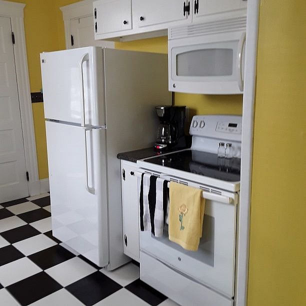 Smooth surface range with self-cleaning oven. 