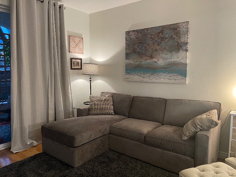 The living area. Calm colors. New furniture. This is a queen size pull out bed for guests. 
