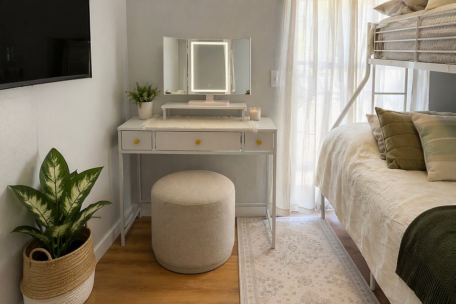 Bonus Getting-Ready Nook In addition to the queen-over-twin bunk bed, this room features a petite vanity by the window, giving a dedicated spot to get ready without tying up the bathroom.