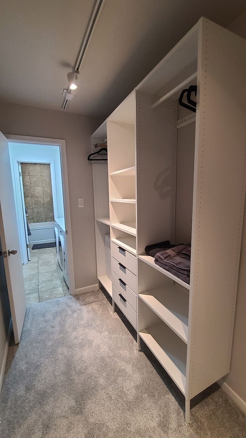 Closet with storage space and laundry basket