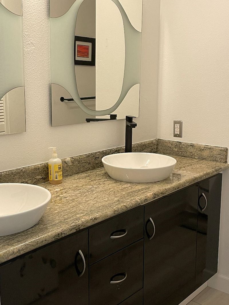 Full bath upstairs with double vanity.