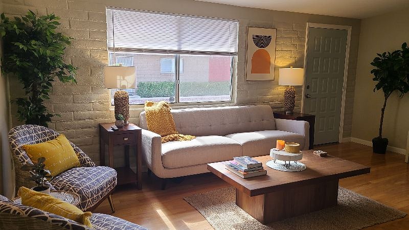 Living room. Large window provides lots of natural light.