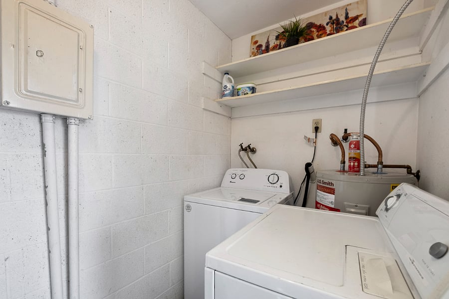 Private Laundry Room with storage shelving. More shelving (not shown)