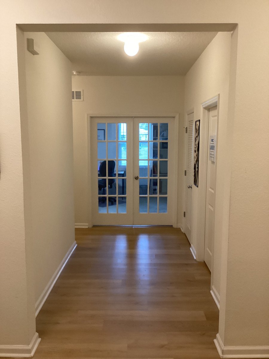 HALL WAY - leading to laundry room, office, guests rooms and guests bathroom.